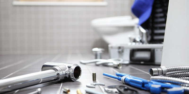 plumber tools and equipment in a bathroom, plumbing repair service, assemble and install concept